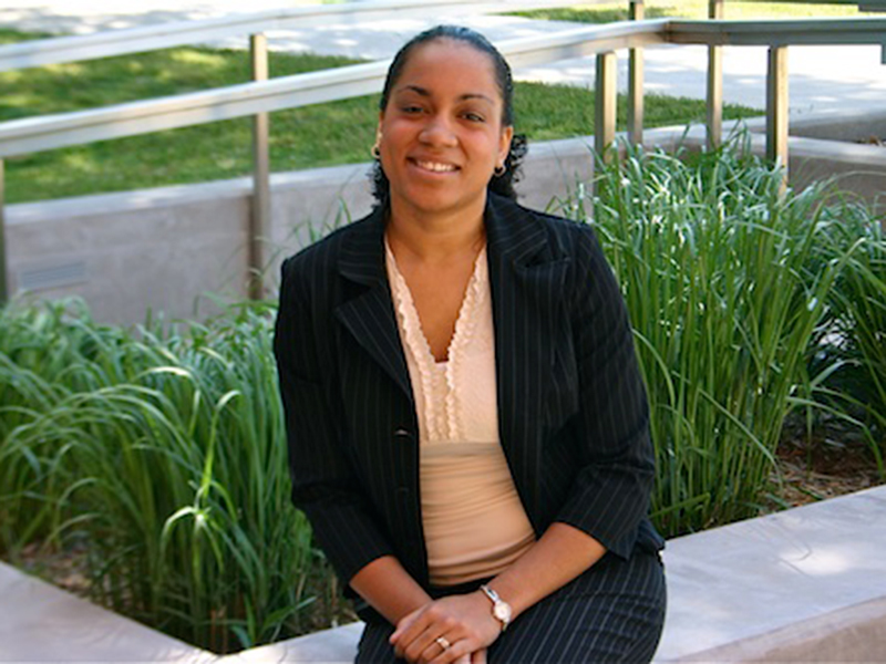 Ebonie Hill, the honors program coordinator, smiles for a portrait.